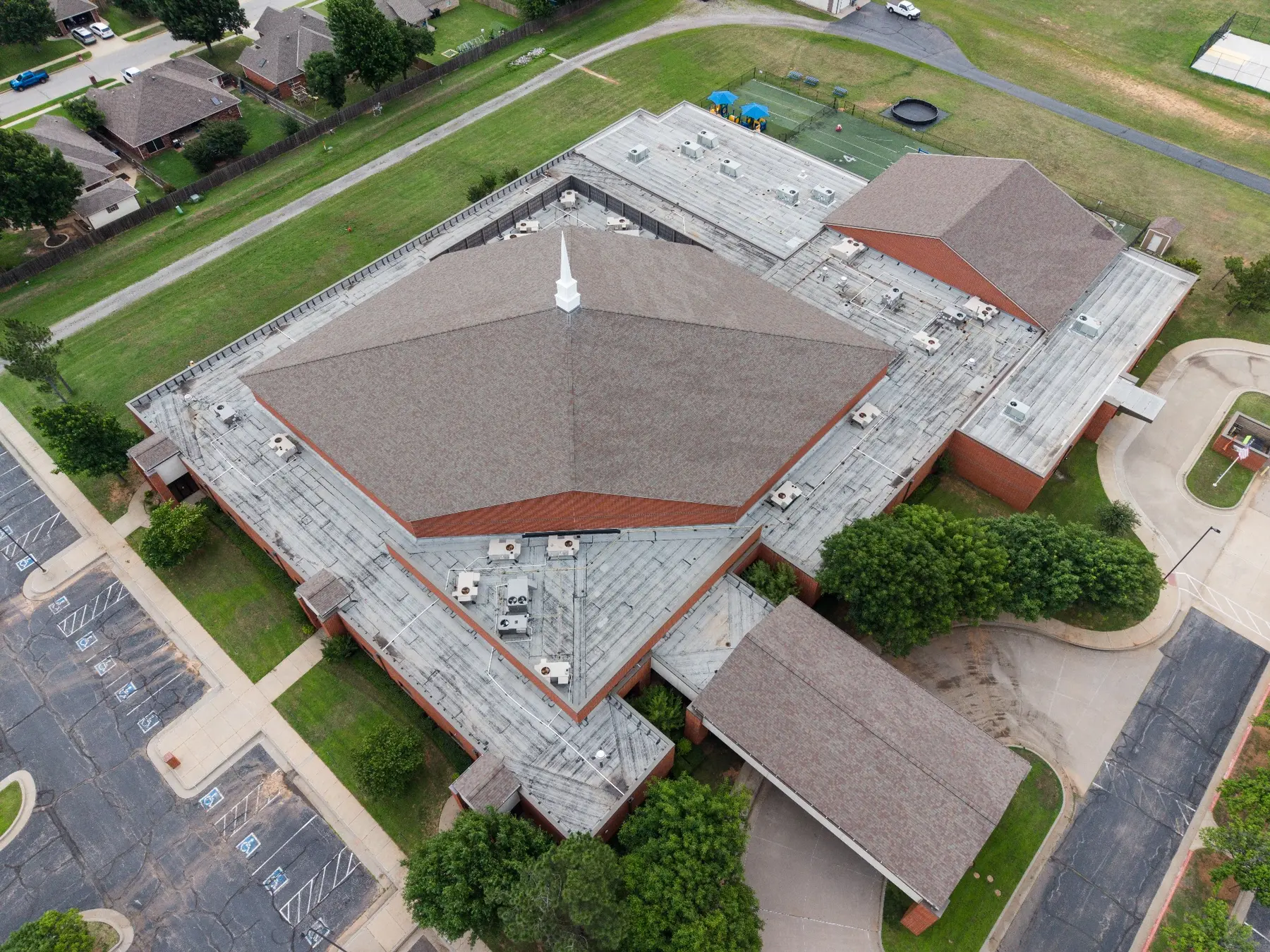 Aerial before view of Yukon COC roof replacement project