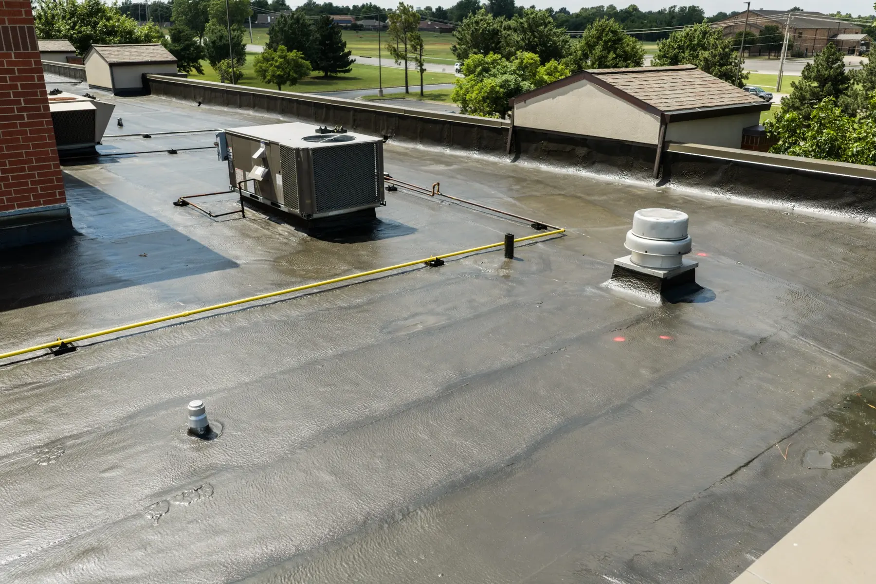 Commercial flat roof section during Yukon COC replacement work