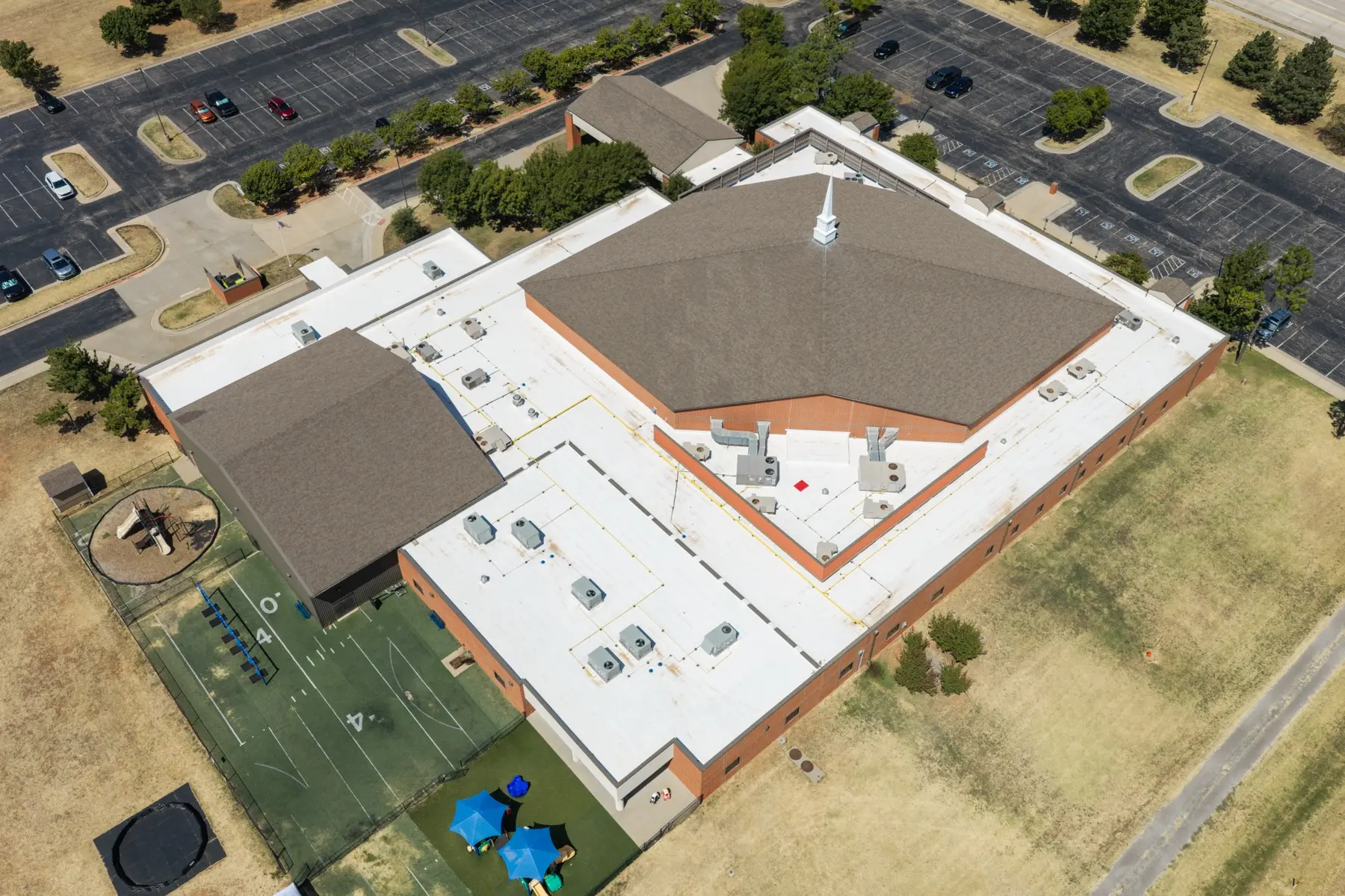 Drone view of white commercial roof section at Yukon COC